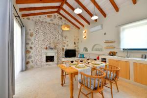 a kitchen and dining room with a table and chairs at Sojoy Villa Allure in Fethiye