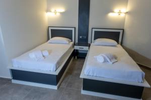 Postel nebo postele na pokoji v ubytování Pera Side Hotel