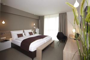 Postel nebo postele na pokoji v ubytování Hotel Kapellenberg
