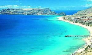 a view of a beach with blue water at Casa Gouveia in Porto Santo