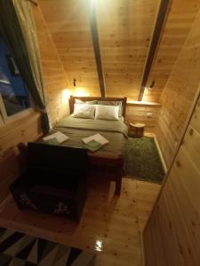 an overhead view of a bed in a tiny house at Cottage Usovic in Žabljak
