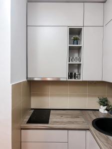 Una cocina o cocineta en Apartman Vas dom 2