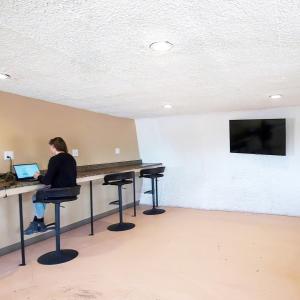 a person sitting at a desk with a laptop at Double Eagle in Valle