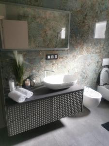 a bathroom with two sinks and a mirror at Lunisa VS1 Apartment in Kostrena