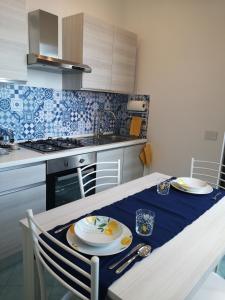 a kitchen with a table with a plate of eggs on it at Villa Furoris Apartment in Furore