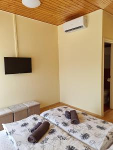 Posteľ alebo postele v izbe v ubytovaní Lilian apartmanház