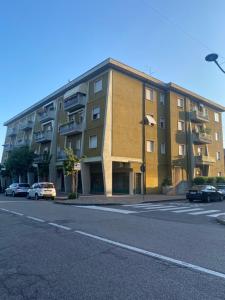 a building on a street with cars parked in front of it at Green House Caldiero in Caldiero