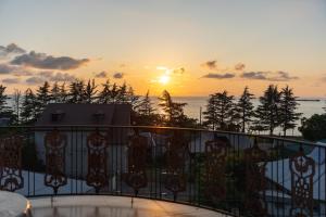 a sunset from the balcony of a house at Batumi Homestay at Tamar Mephe Avenue in Makhinjauri