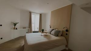 Ένα ή περισσότερα κρεβάτια σε δωμάτιο στο Ô république