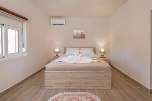 Postel nebo postele na pokoji v ubytování Casa di Gianna