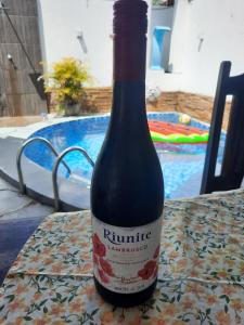 a bottle of wine sitting on a table at A KAsinha do Murubira in Mosqueiro