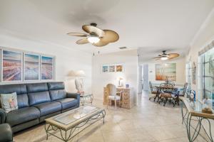 a living room with a couch and a table at Banyan House Vacation Rentals in Venice