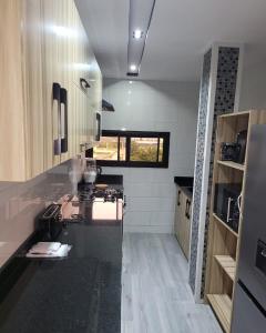 a kitchen with a sink and a counter top at Giani Lodge in Lomé