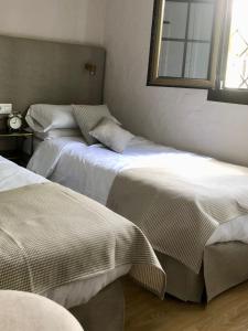 Postel nebo postele na pokoji v ubytování Santa Clara Bungalows