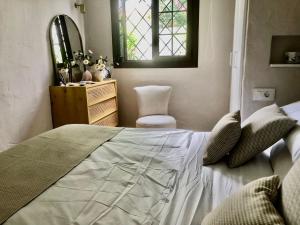 Postel nebo postele na pokoji v ubytování Santa Clara Bungalows