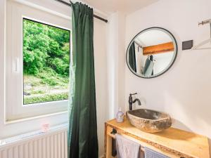 a bathroom with a sink and a window at Holiday Home Near the Rhine River in Sankt Goarshausen
