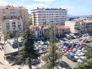 a parking lot full of cars in a city at İsra Suit in Trabzon