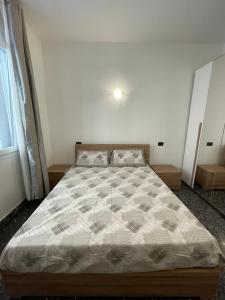 a bedroom with a large bed in a room at Due passi dal mare in Savona