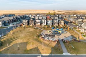 an aerial view of a town with houses and a playground at Luxurious Comfortable Suite in Airdrie