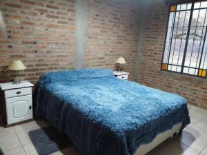 Tempat tidur dalam kamar di Casa del viñedo