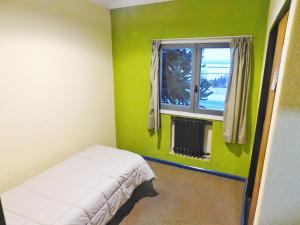 Postel nebo postele na pokoji v ubytování HOSTEL ARRAYAN BARILOCHE