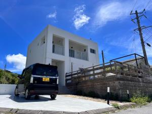 a small vehicle parked in front of a building at Cinema Villa in Shushi