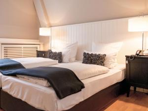 Cama ou camas em um quarto em Hotel Victoria