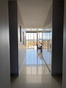 a hallway of a house with a view of the ocean at Redvue Holiday Apartments in Redcliffe