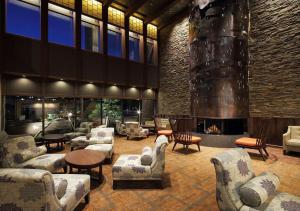 a lobby with couches and chairs and a fireplace at Hakodate Hotel Banso in Hakodate