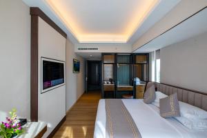 Sayarsan Hotel Yangon客房内的一张或多张床位