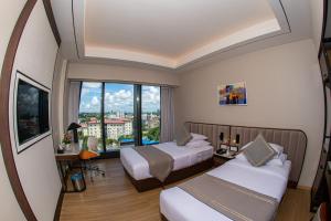 Sayarsan Hotel Yangon客房内的一张或多张床位