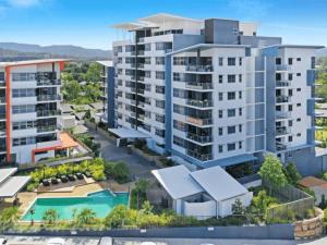 an aerial view of an apartment complex with a pool at Two bedroom Apartment in Robina Center in Gold Coast