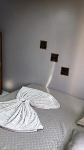 Tempat tidur dalam kamar di Tangará da Serra