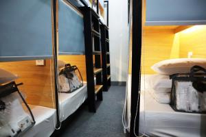 Postel nebo postele na pokoji v ubytování AMANGO HOSTEL