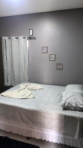 Uma cama ou camas num quarto em Tangará da Serra