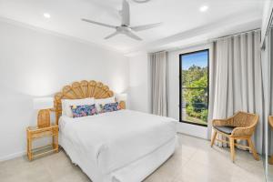 Ένα ή περισσότερα κρεβάτια σε δωμάτιο στο Belle Escapes Havenly Luxury Villa Palm Cove +30 φωτογραφίες