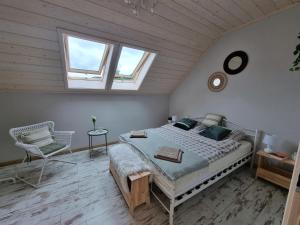 En eller flere senger på et rom på Apartament Domek w Górach Gorce Pieniny