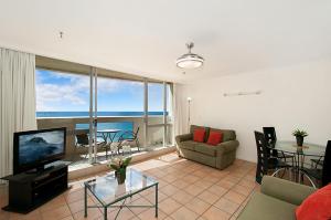 a living room with a view of the ocean at Focus Apartments in Gold Coast