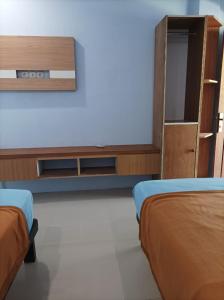 Ένα ή περισσότερα κρεβάτια σε δωμάτιο στο Merendeng Hostel Kuta