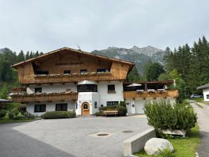 a large building with a wooden roof at W7 Haus Ganghofer in Leutasch
