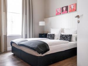 Cama ou camas em um quarto em Hotel Victoria