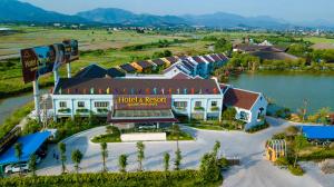 an aerial view of a hotel and resort with a lake at Quảng Ninh Gate Hotel & Resort in Bác Mã
