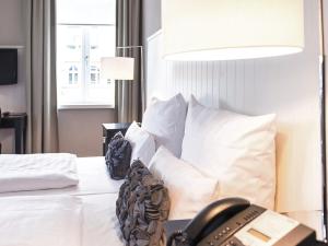Cama ou camas em um quarto em Hotel Victoria