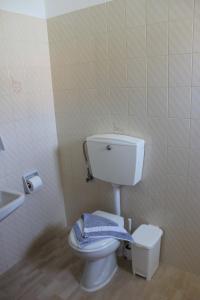 a bathroom with a toilet and a sink at KIMASIS by Maria in Samos