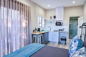 a small kitchen with a sink and a counter at 21 on Cathcart in Port Elizabeth