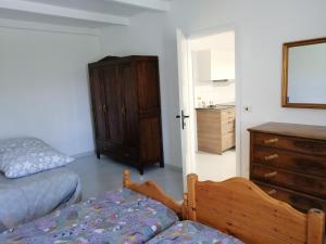a room with a bed and a dresser and a bedroom at Residence Moulin in Aymavilles