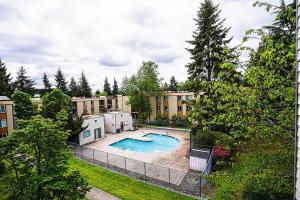 an overhead view of a swimming pool in a yard at Modern Microsoft Redmond Campus Condo with Balcony in Bellevue