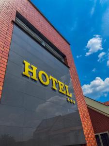 a hotel sign on the side of a building at Hotel Adria in Ruda Śląska