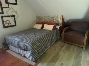 Postel nebo postele na pokoji v ubytování LE CLOCOONING Chambres d'Hôtes chez l'habitant