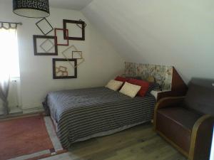 Postel nebo postele na pokoji v ubytování LE CLOCOONING Chambres d'Hôtes chez l'habitant